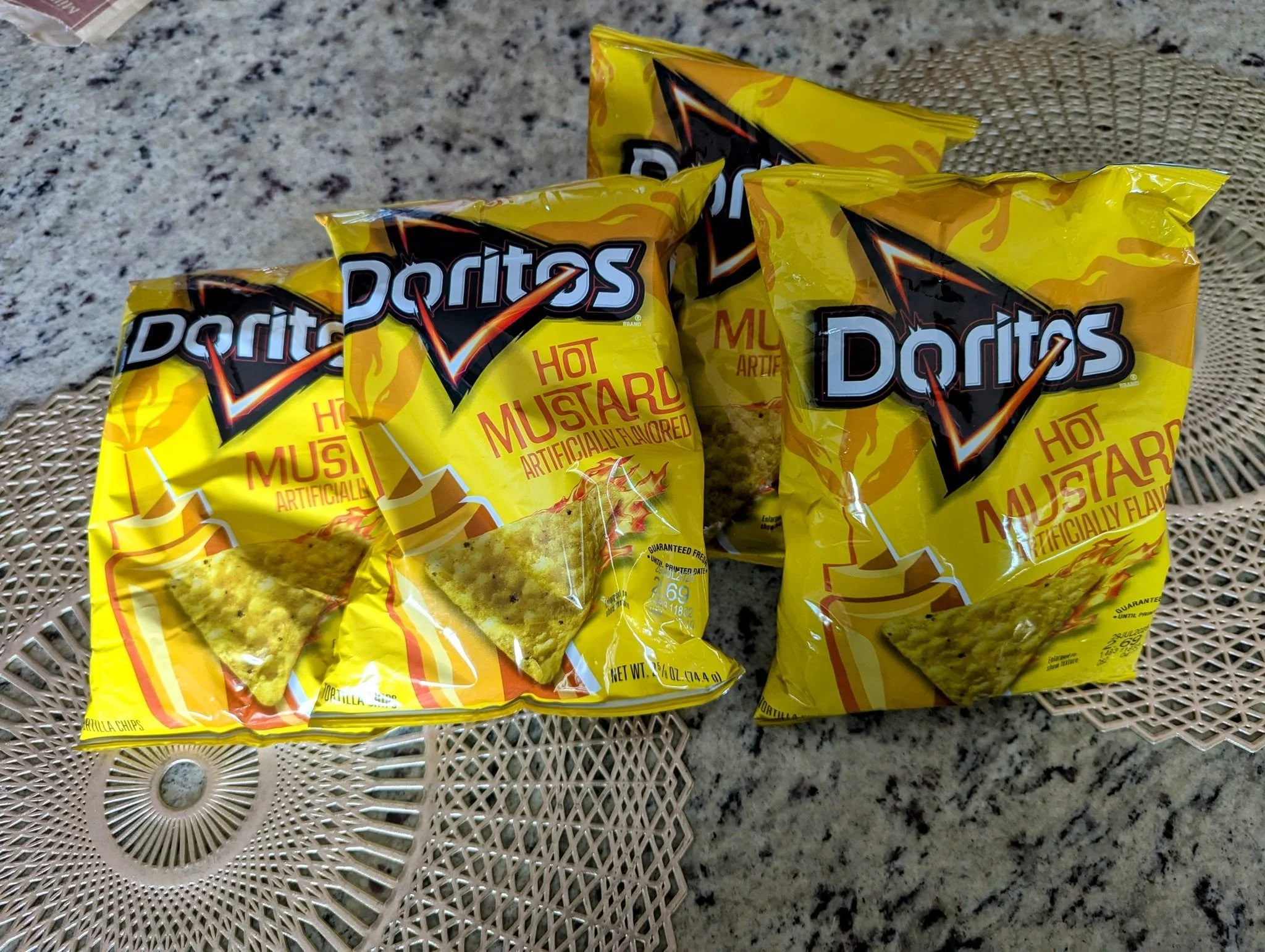 Bags of limited-release Hot Mustard Doritos discovered at a Colorado 7-Eleven during our August 2025 trip.
