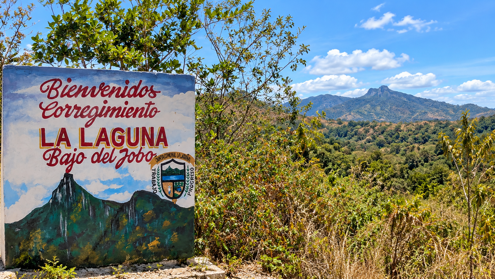 Hand-painted roadside sign welcoming visitors to La Laguna in the rural mountains of Panama.
