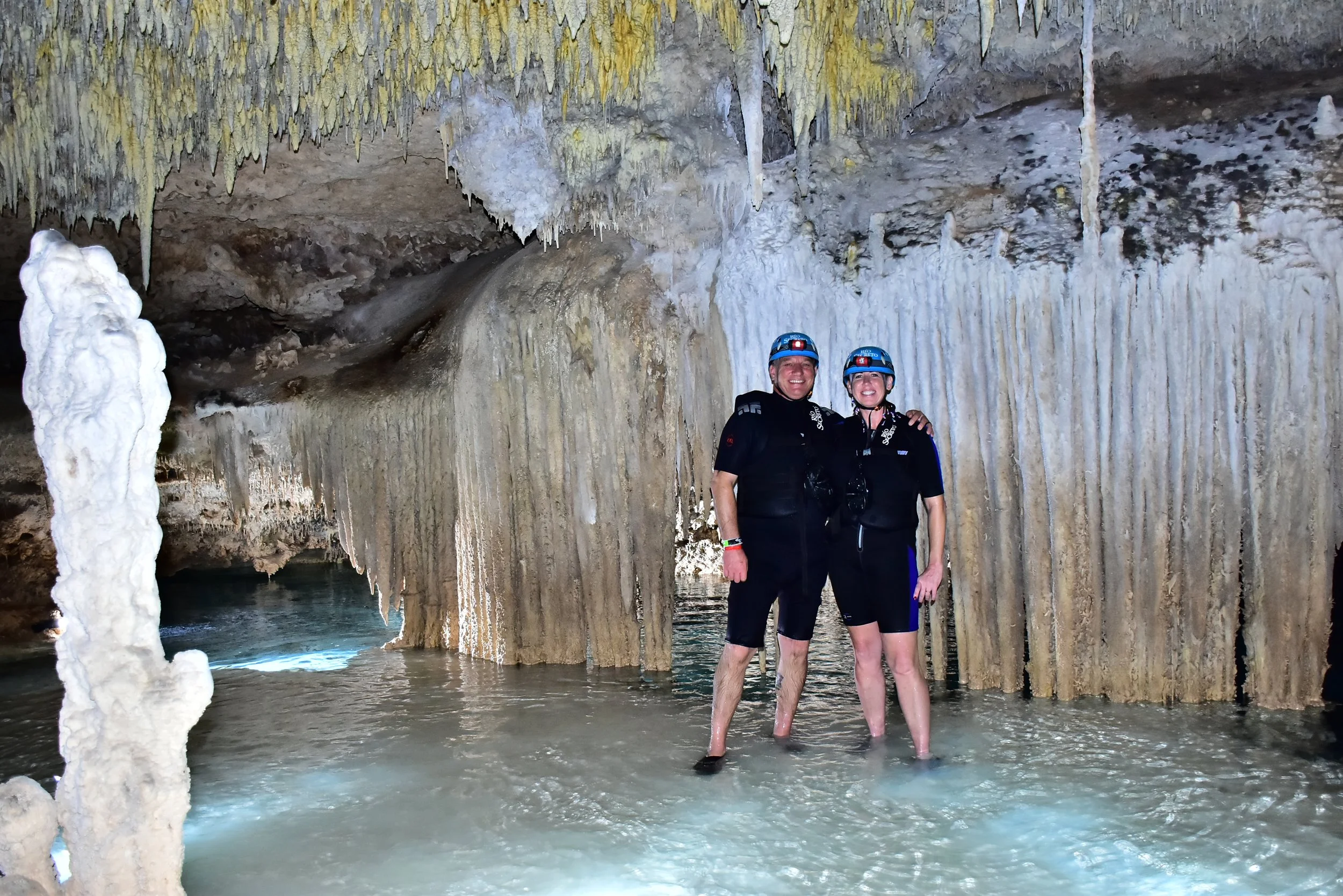 Underground rock formations and clear water inside Rio Secreto.