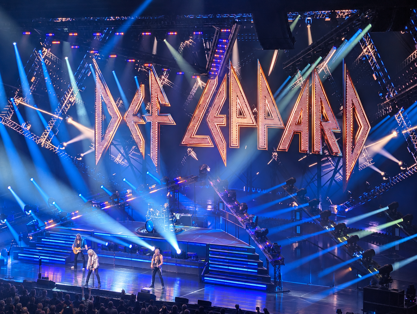 Def Leppard performing beneath the band’s illuminated stage logo at the Colosseum at Caesars Palace.