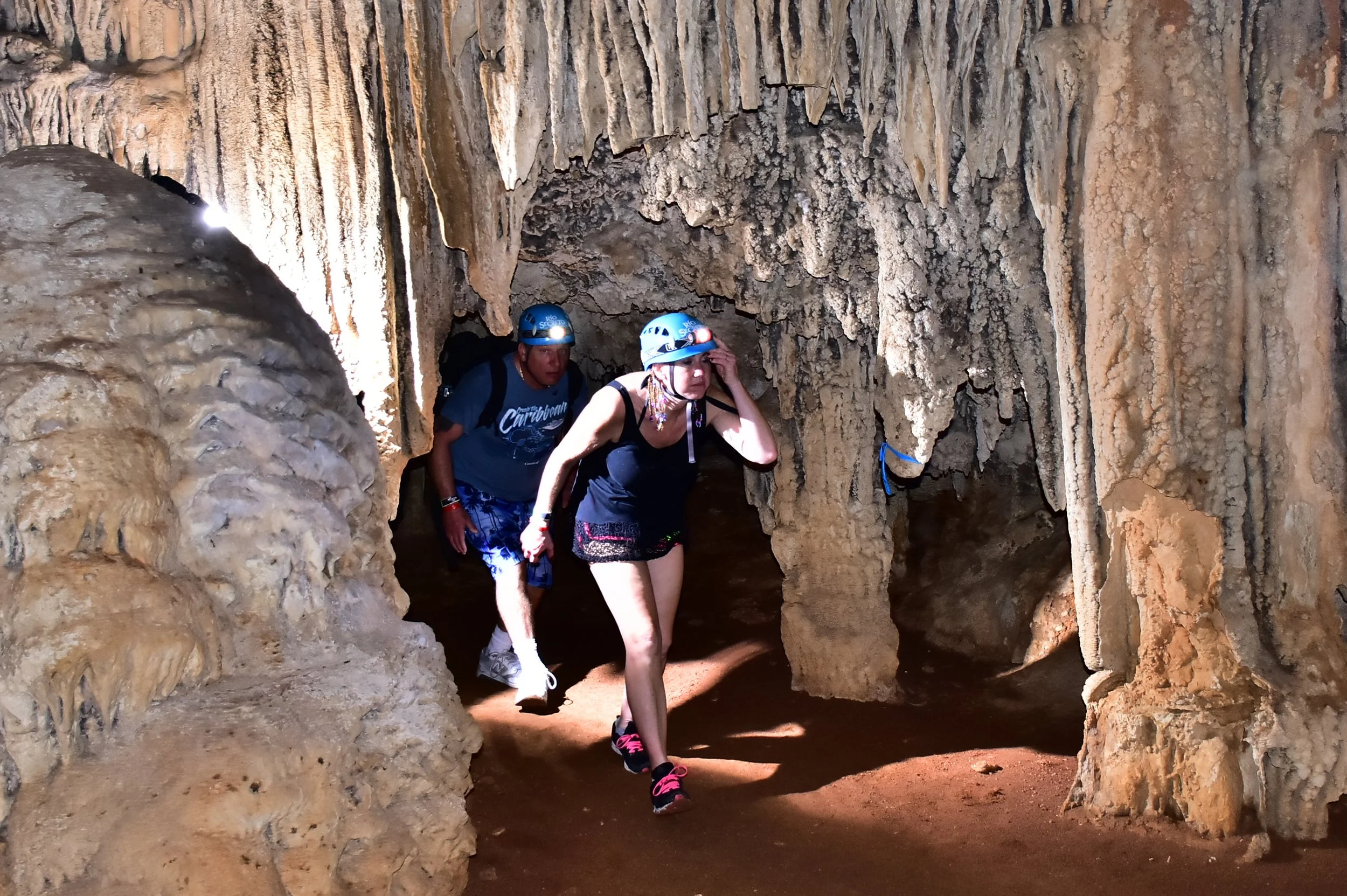 Professional photograph of Brian and Gina together inside the Río Secreto underground cave system.