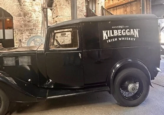 Historic Kilbeggan Irish whiskey delivery truck displayed at Kilbeggan Distillery in Ireland.