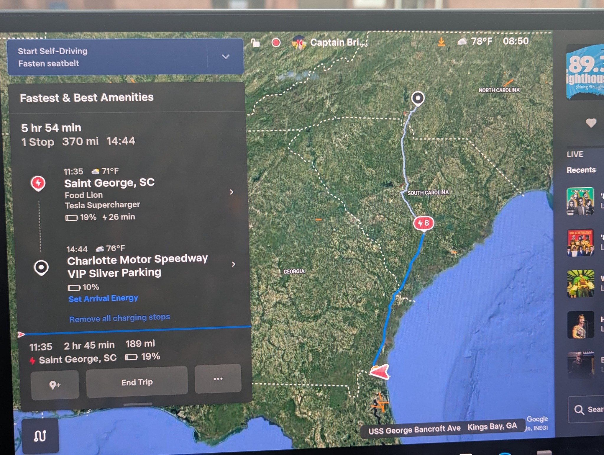 Tesla navigation displaying the route from Kings Bay, Georgia, to Charlotte Motor Speedway, including a proposed Supercharger stop in Saint George, South Carolina, charging time, and estimated battery levels.