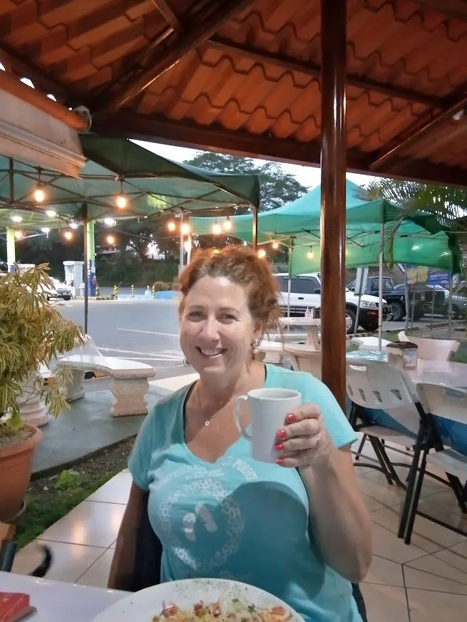 Gina enjoying a meal at an open-air roadside restaurant in Costa Rica recommended by a local rental-car employee.