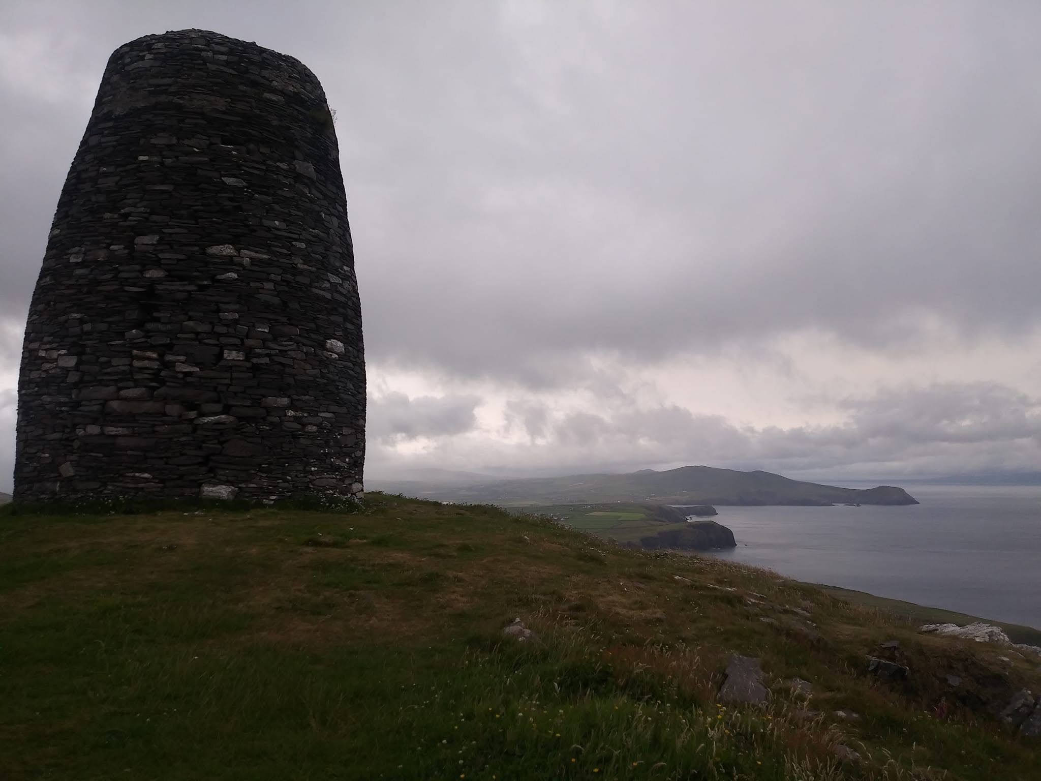 Eask Tower overlooking the coastline and entrance to Dingle Harbour in Ireland