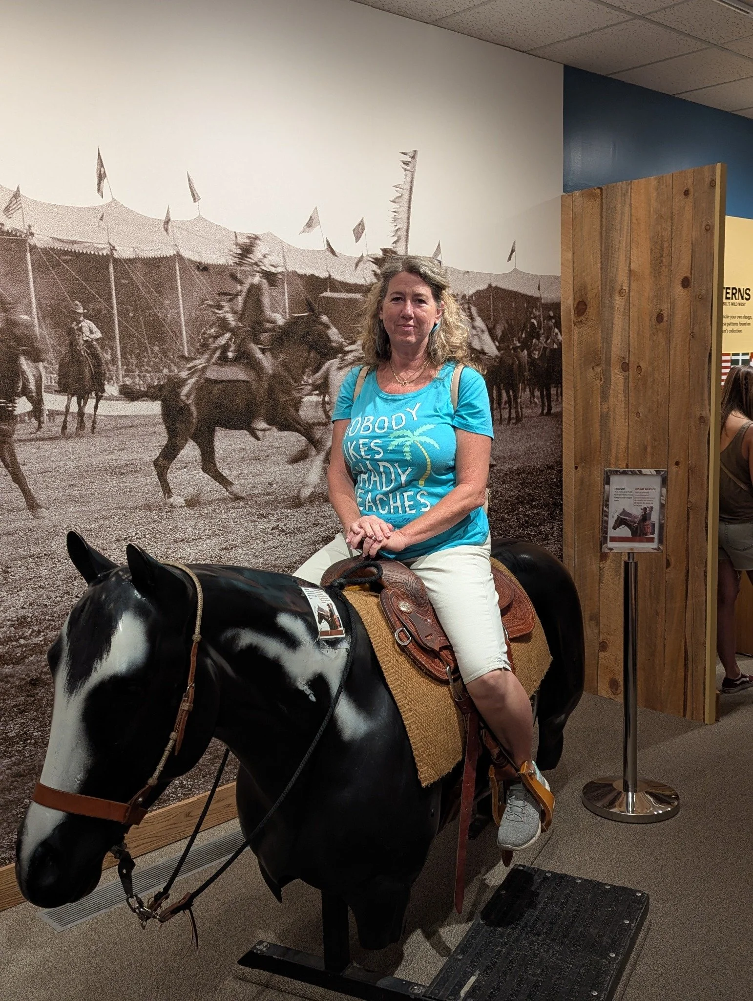 Gina posing on a display horse inside the Buffalo Bill Museum on Lookout Mountain, Colorado.
