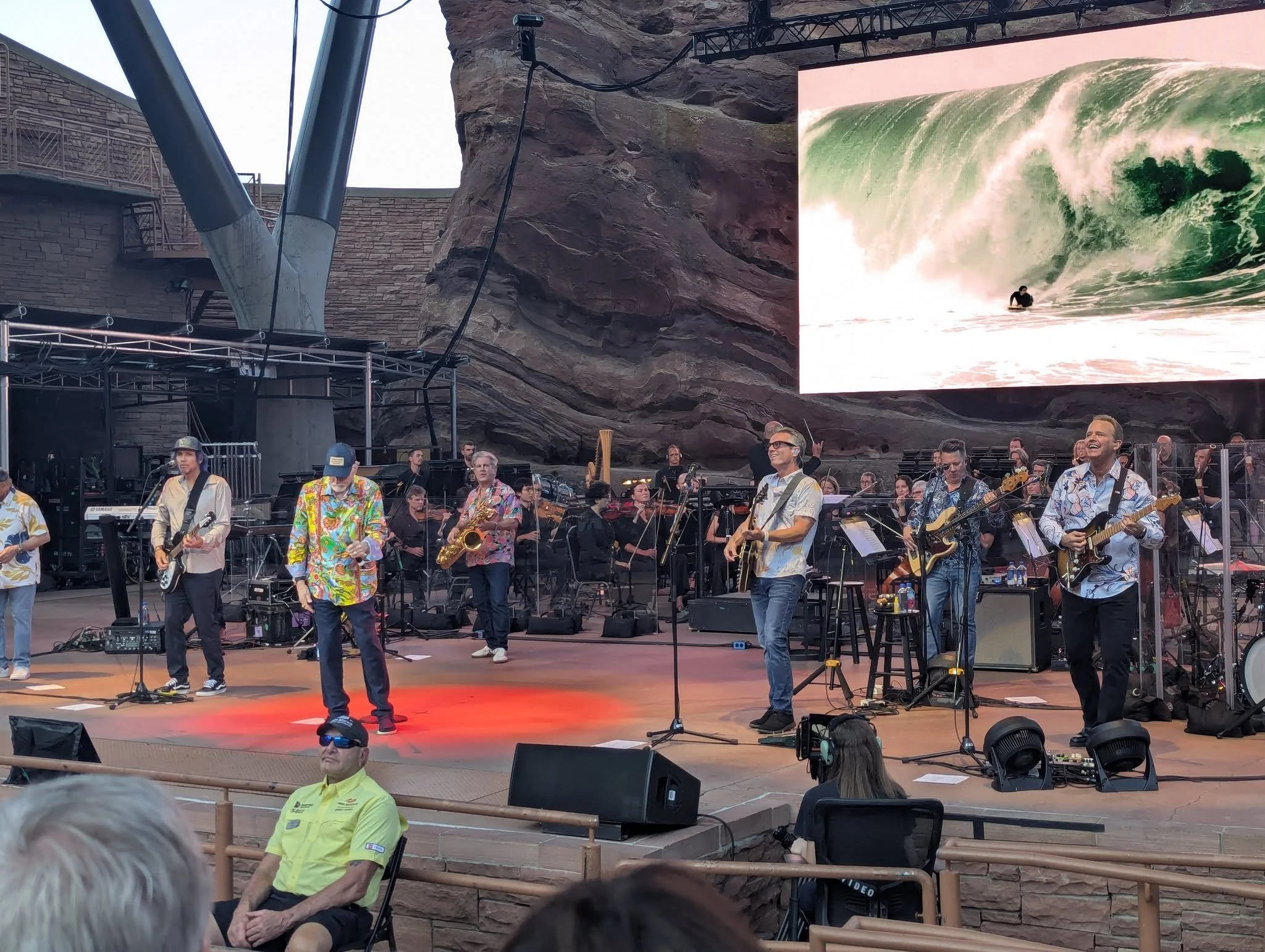 The Beach Boys performing with an orchestra at Red Rocks Amphitheatre in Colorado during their August 2025 concert.