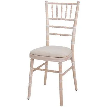 A wooden chair with a cushioned seat and a ladder-back design.