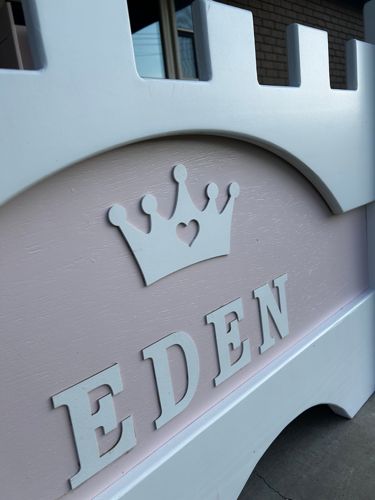 Personalized pink wooden children's furniture sign with the name Eden.