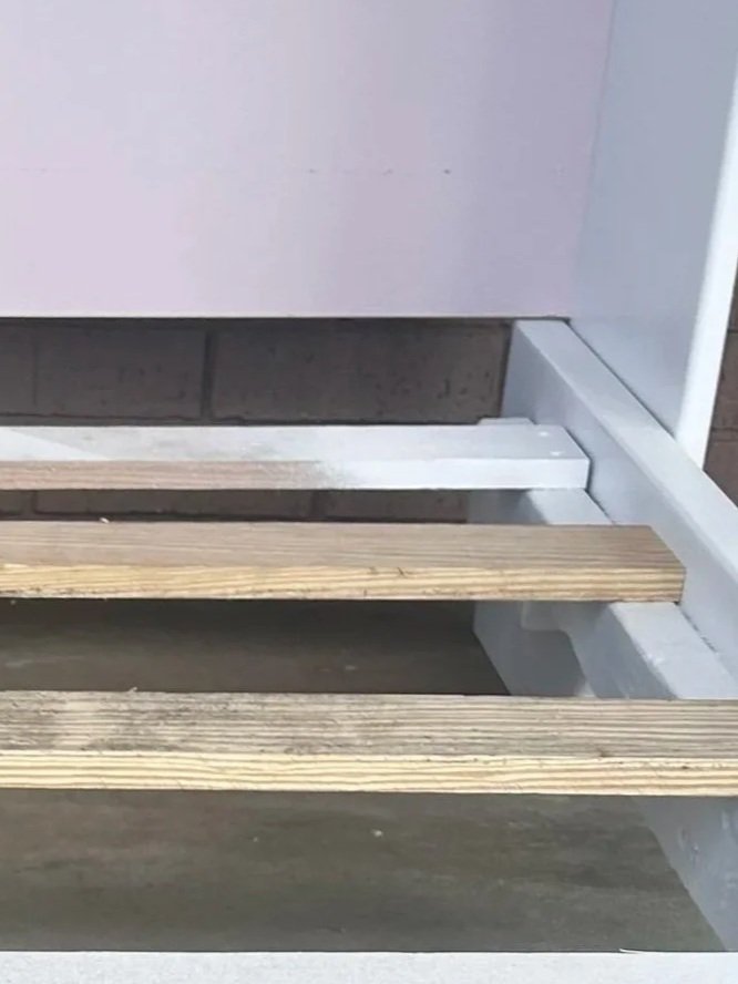 Close-up of the wood construction and design details of a custom children's bed