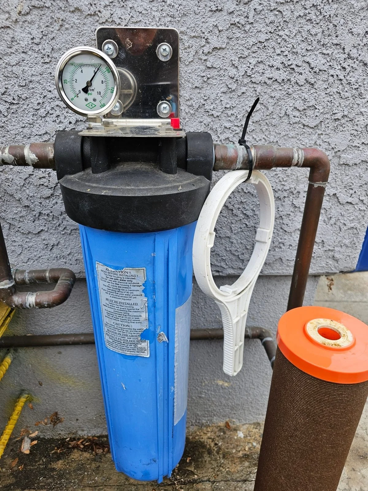 modern showerhead with weak spray trickling water