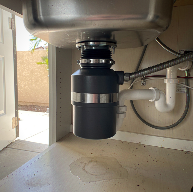 garbage disposal mount loose under kitchen sink