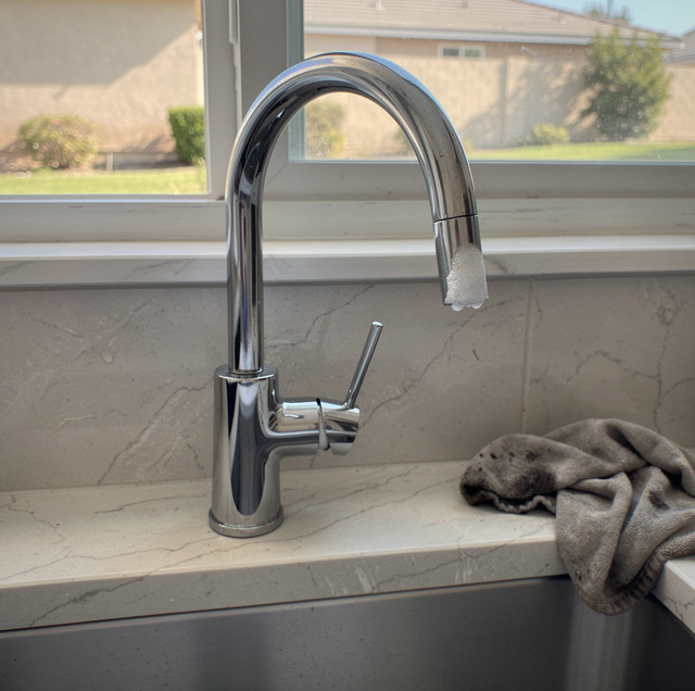 chrome faucet handle scuffed with worn set screw exposed