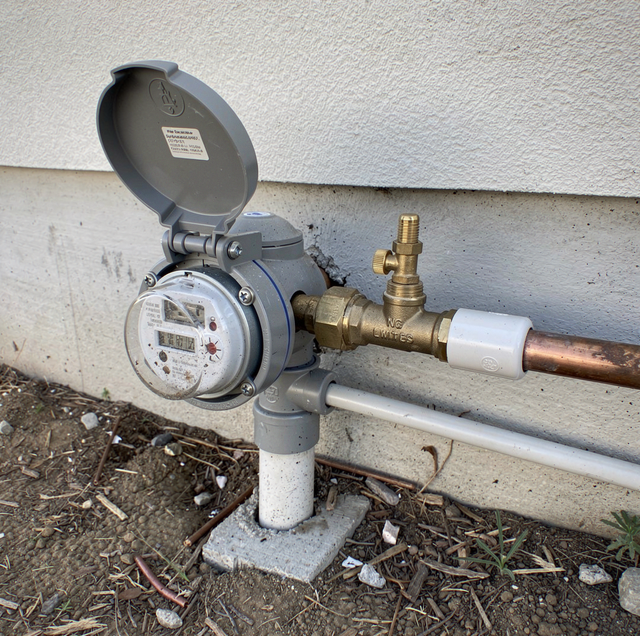 water meter box marker between house and street