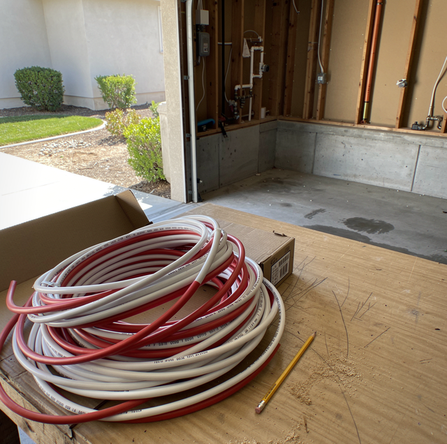 chlorine-exposed PEX pipe tee joint with water drip