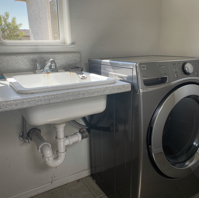 washing machine drain flooding laundry sink basin
