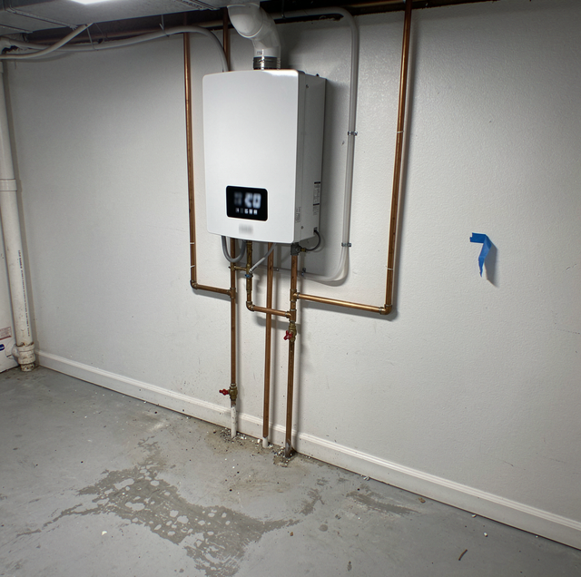 Wall mounted tankless water heater with copper pipes