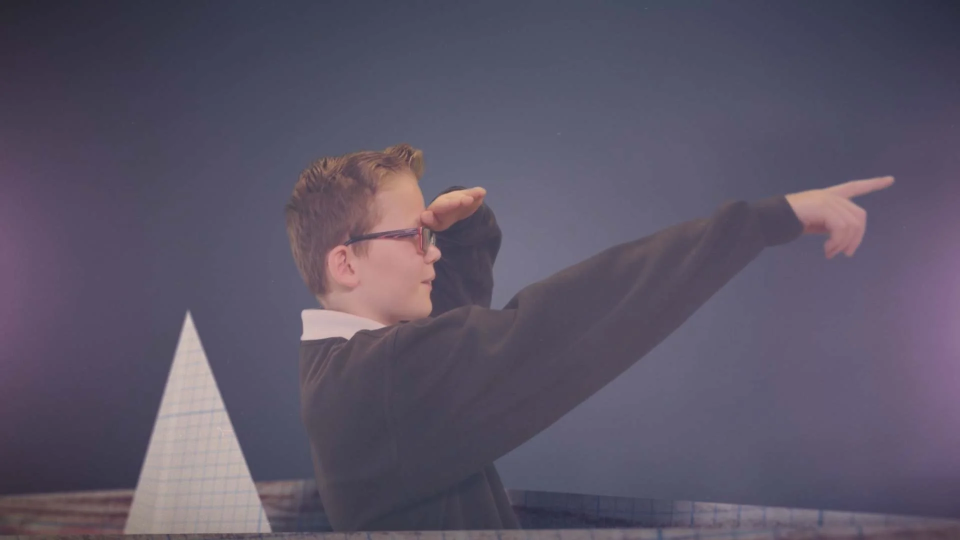 A boy in a paper boat points the way