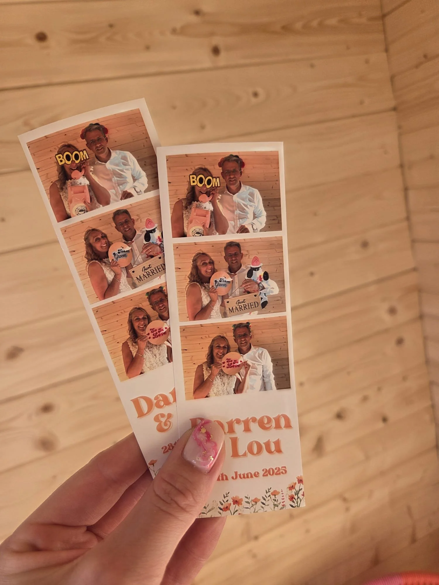 Photobooth photos of a couple at their wedding, holding signs with messages of love and happiness, with a wooden backdrop.