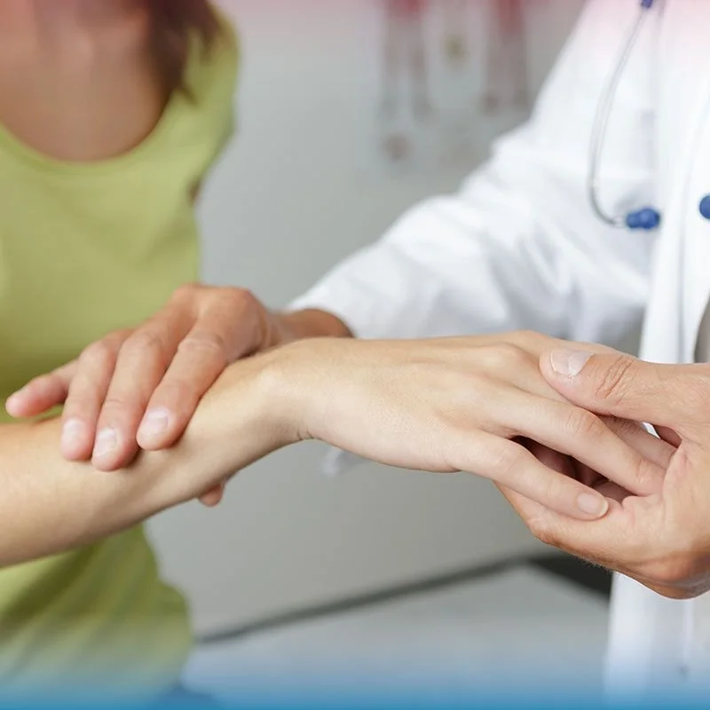 doctor examining patient's wrist