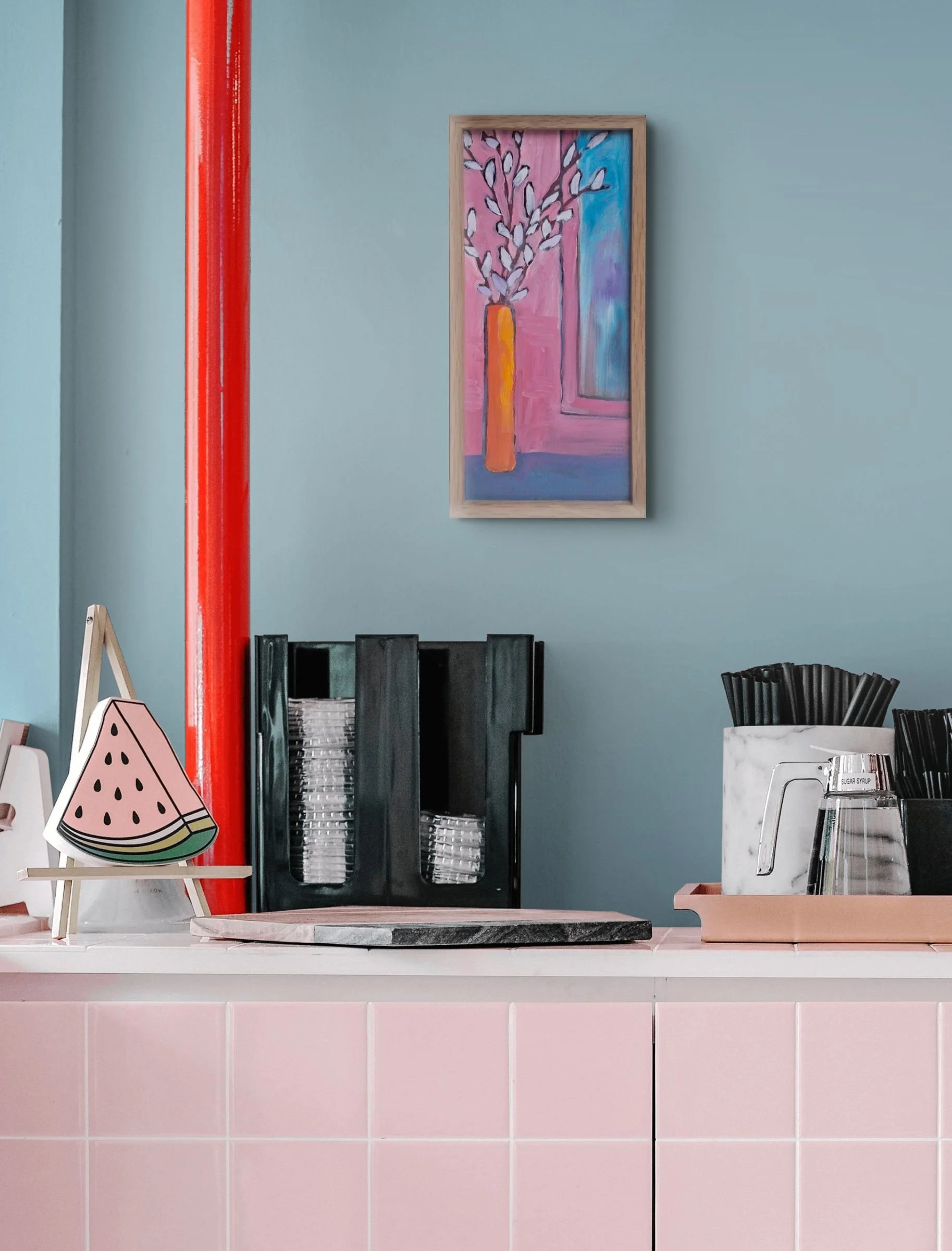 Orange vase in pink and blue room