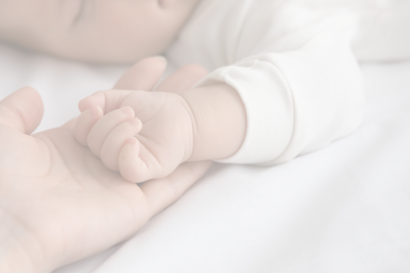 Mother breastfeeding her baby with supportive lactation care