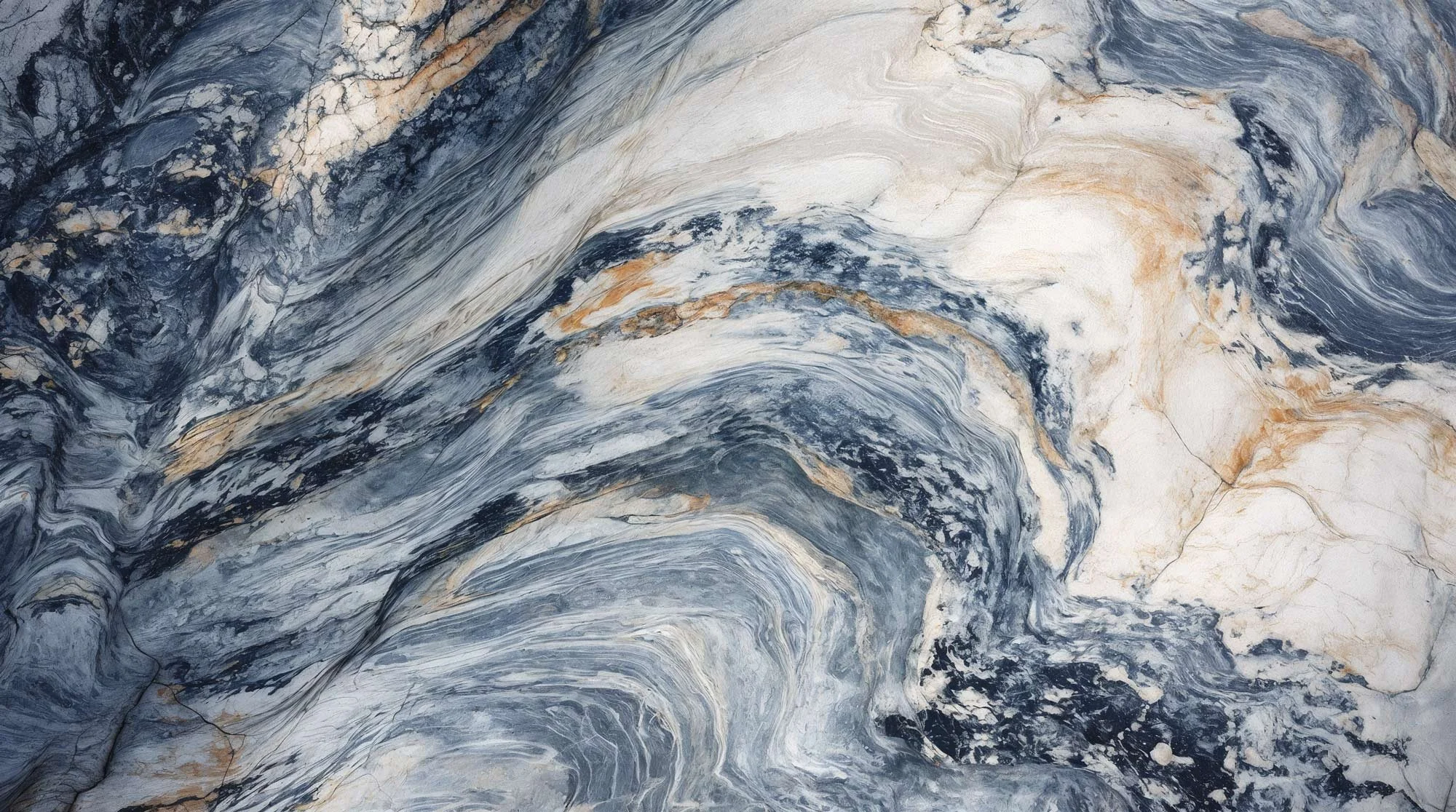 Marble with swirling pattern of black, white, cream, and gold veins.