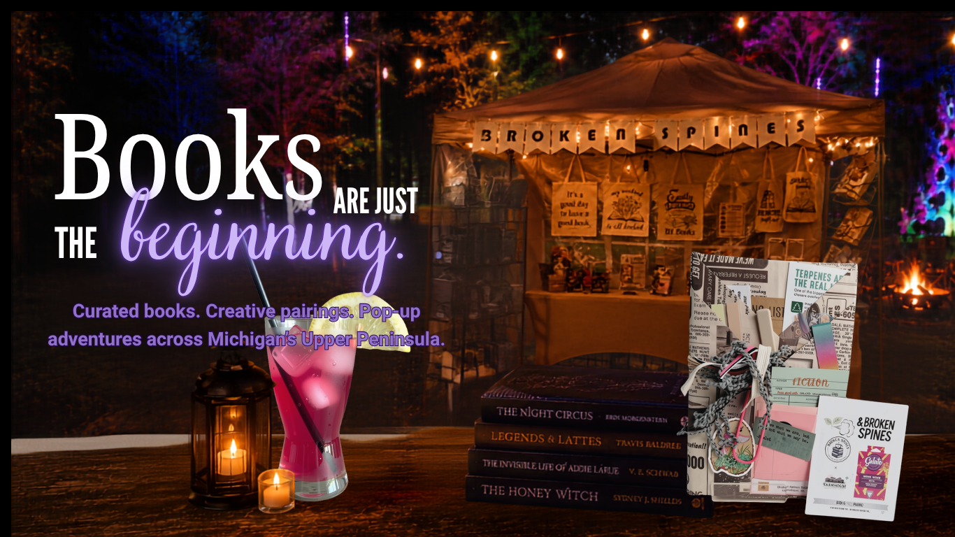 A promotional image for a book event showing a table with books, bookish items, and promotional materials, set against a nighttime outdoor scene with colorful string lights and event tents.