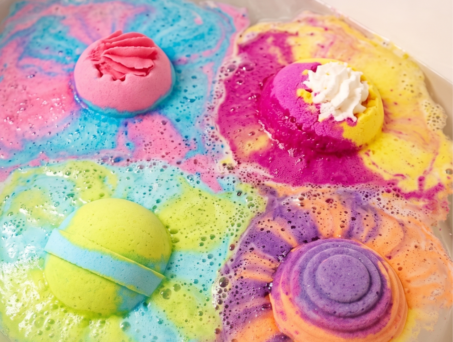A sled shot of AOA Studio bath bombs in a bathtub 