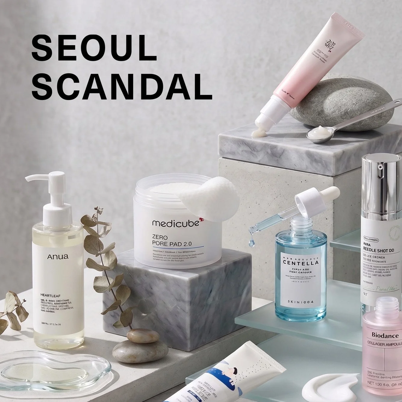 A styled image of K-Beauty skincare products, alongside, the Seoul Scandal logo