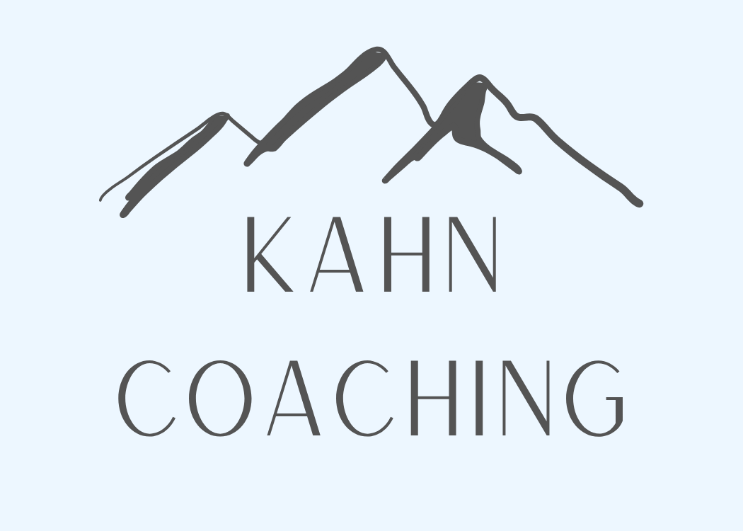 Logo for Kahn Coaching featuring a mountain range and the text 'Kahn Coaching'.