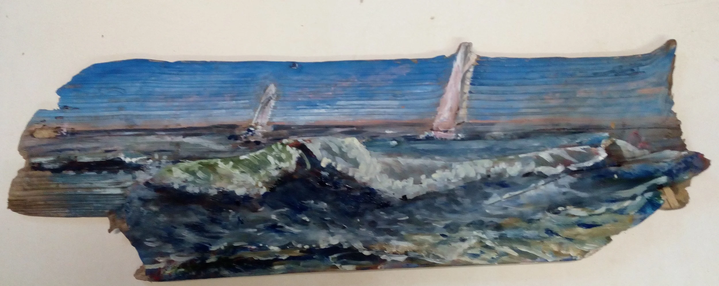 Painting of a boat on the water on a piece of wood.