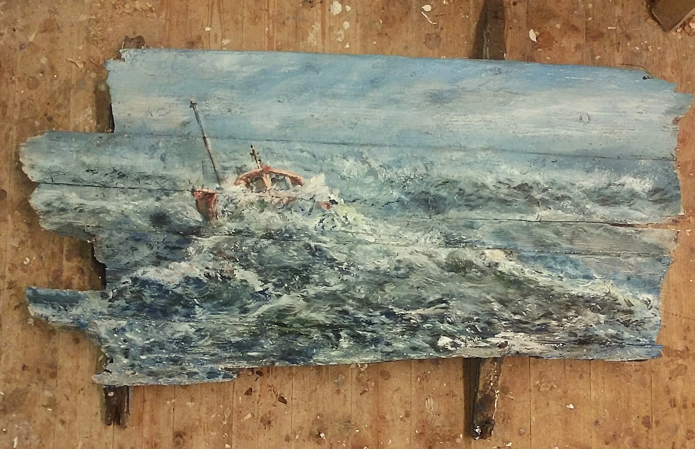 A painting of a shipwreck on a rocky coast, with mountains in the background, painted in an impressionistic style.