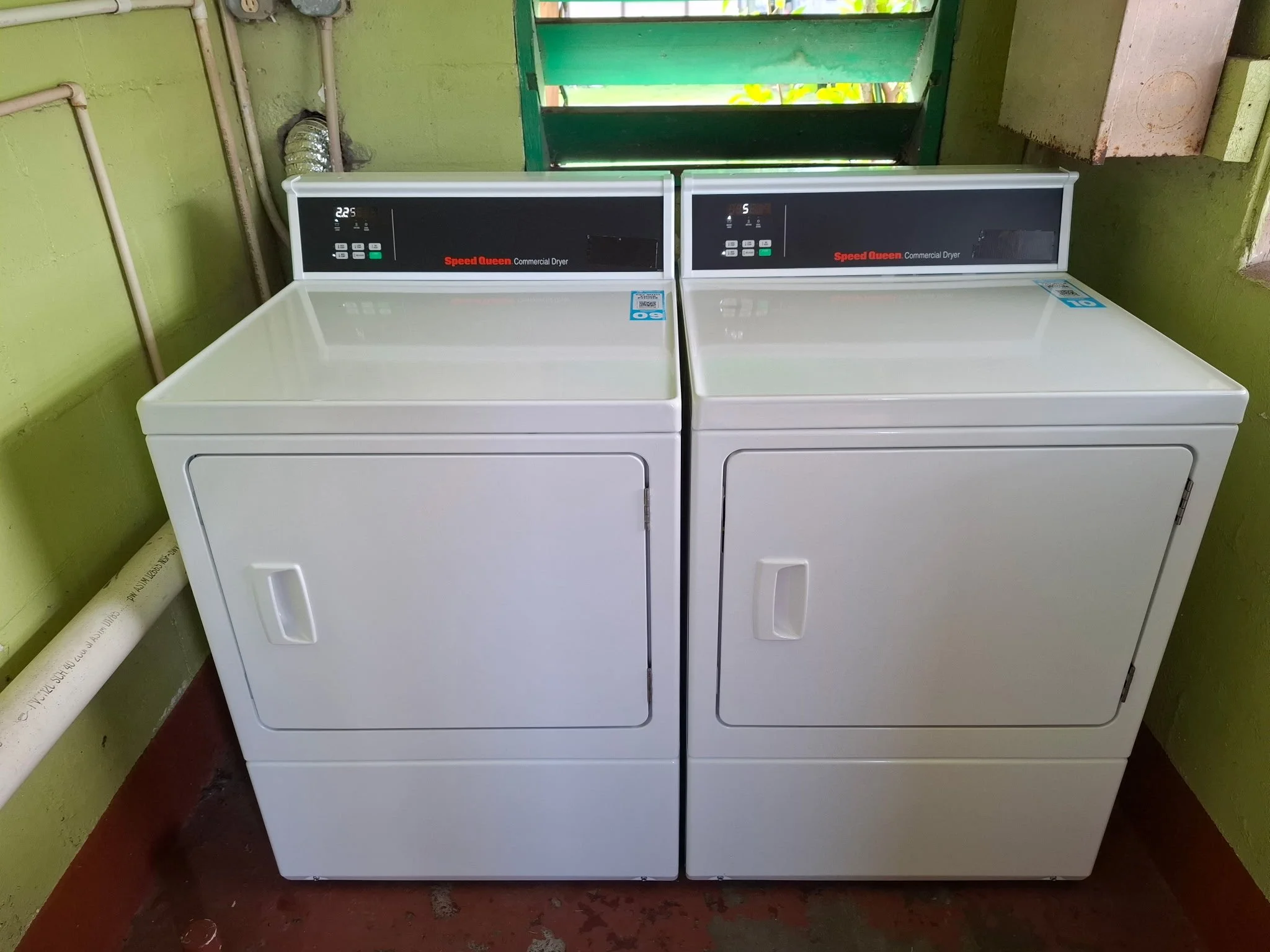 Dryers inside the laundry facility at Creekside Mobile Home and RV Park