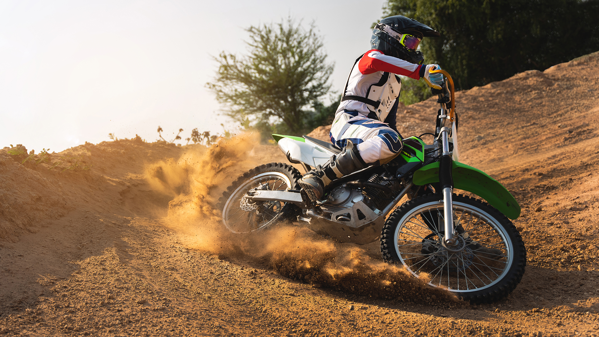 young-man-practice-riding-dirt-bike-splashing-sand-2026-01-11-08-40-59-utc 1.png