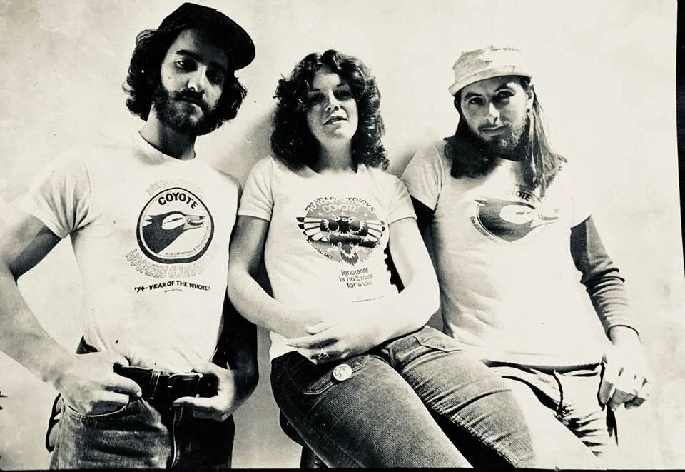 Pictured from left to right is Anthony Minstein, Donna Houpt, and David Wills, from a 1976 advertisement for T-shirts that I designed for Coyote.
