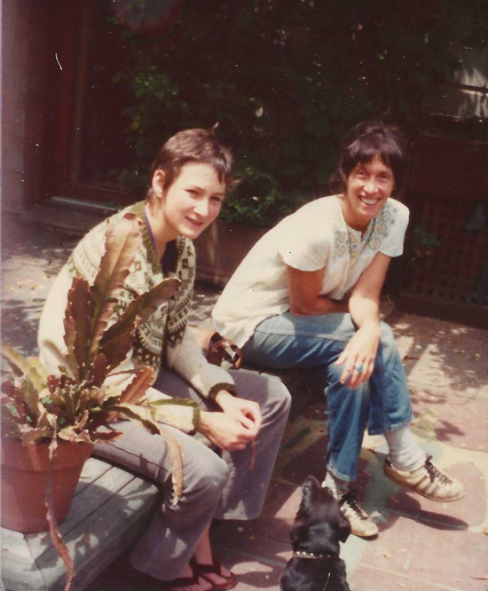Susan Brenner and Margo St James and Jalisco the dog, outside the big house at Druid Heights in Mill Valley, 1970s.