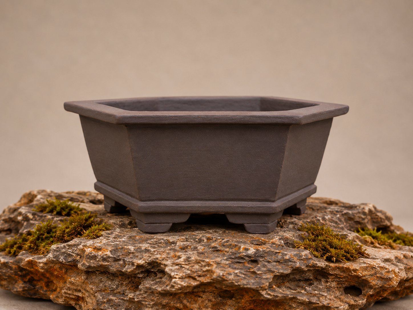Handcrafted hexagonal quince bonsai pot from the Seasons Restrained collection, featuring a wide crown rim in Sea Kelp, by Ian Jobling Ceramics.