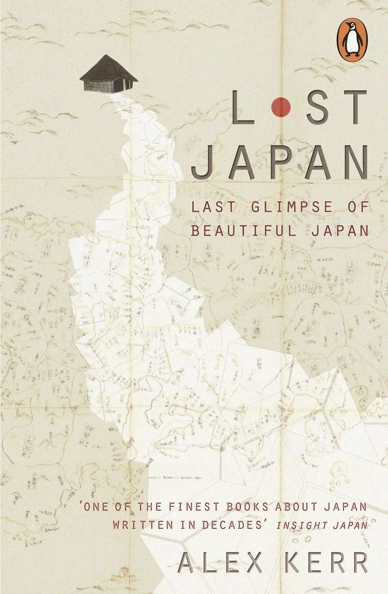 Cover of the book "Lost Japan" by Alex Kerr, showing a vintage map of Japan and a small house on top of a mountain, with the Penguin logo in the top right corner.