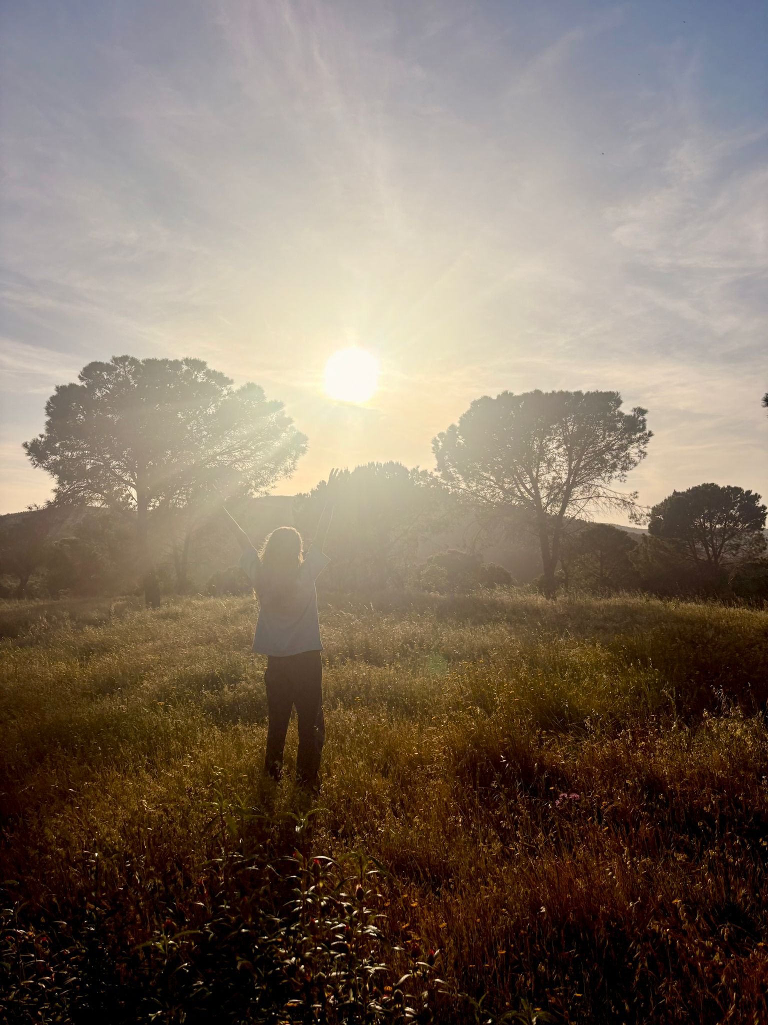 Founder Félice walking the land at Bravura at sunset