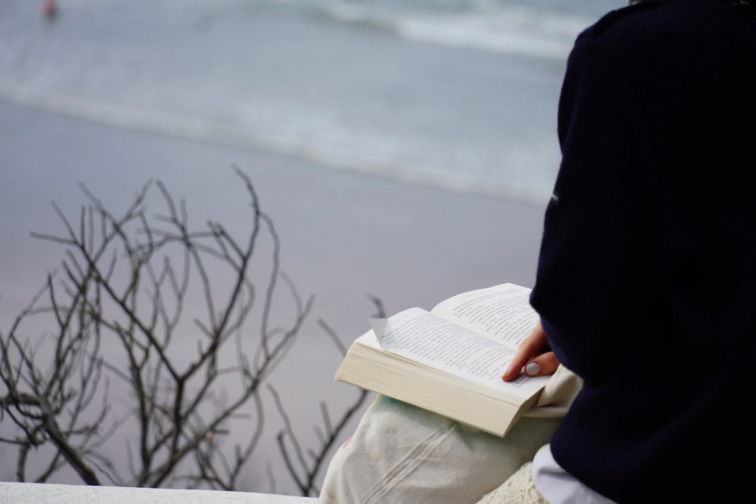 Reading a book on the beach after a day of ceramics in the Algarve