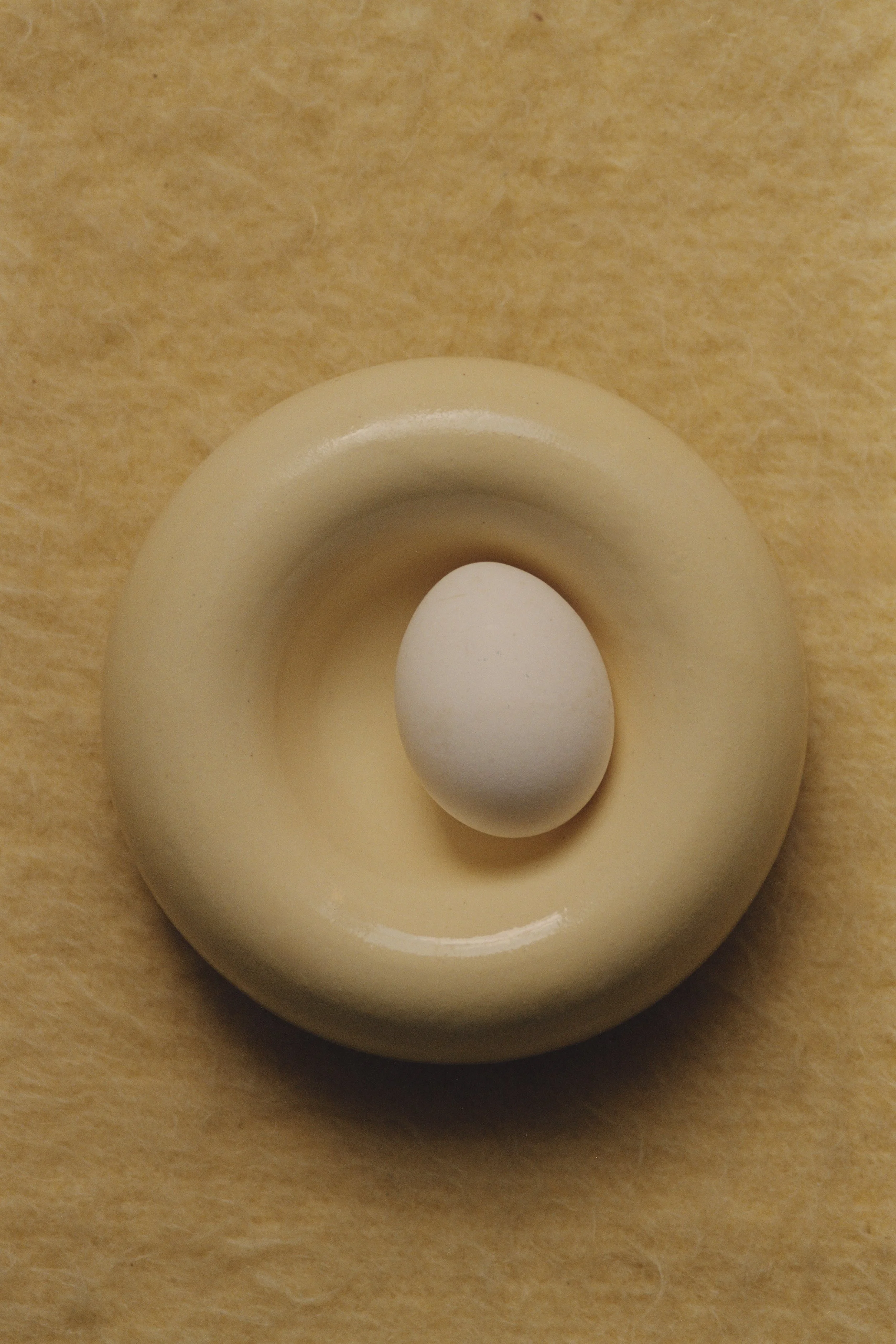 Ring-shaped ceramic egg holder by Chiara Caselli