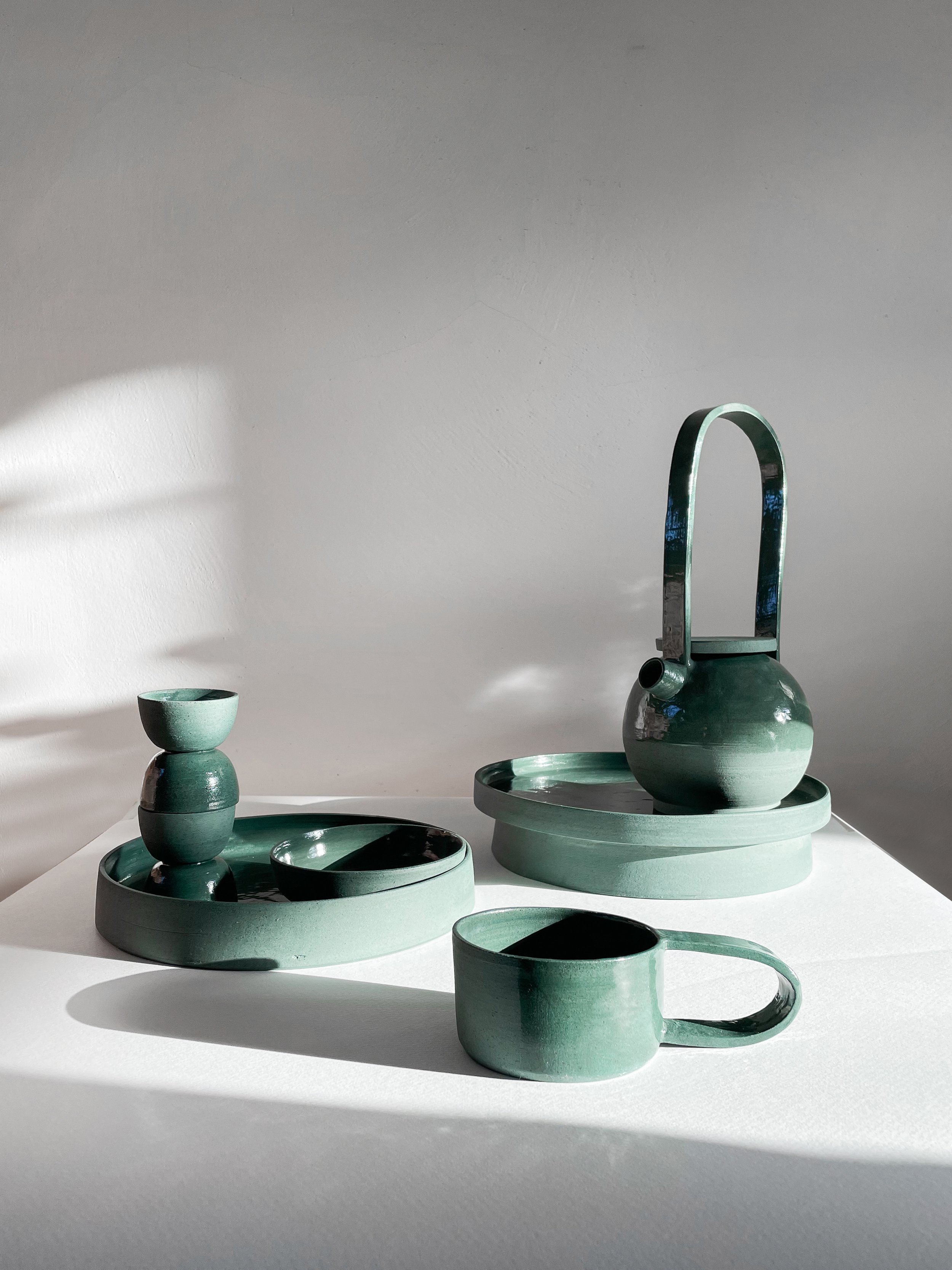 Green glazed teapot and tableware by Chiara Caselli