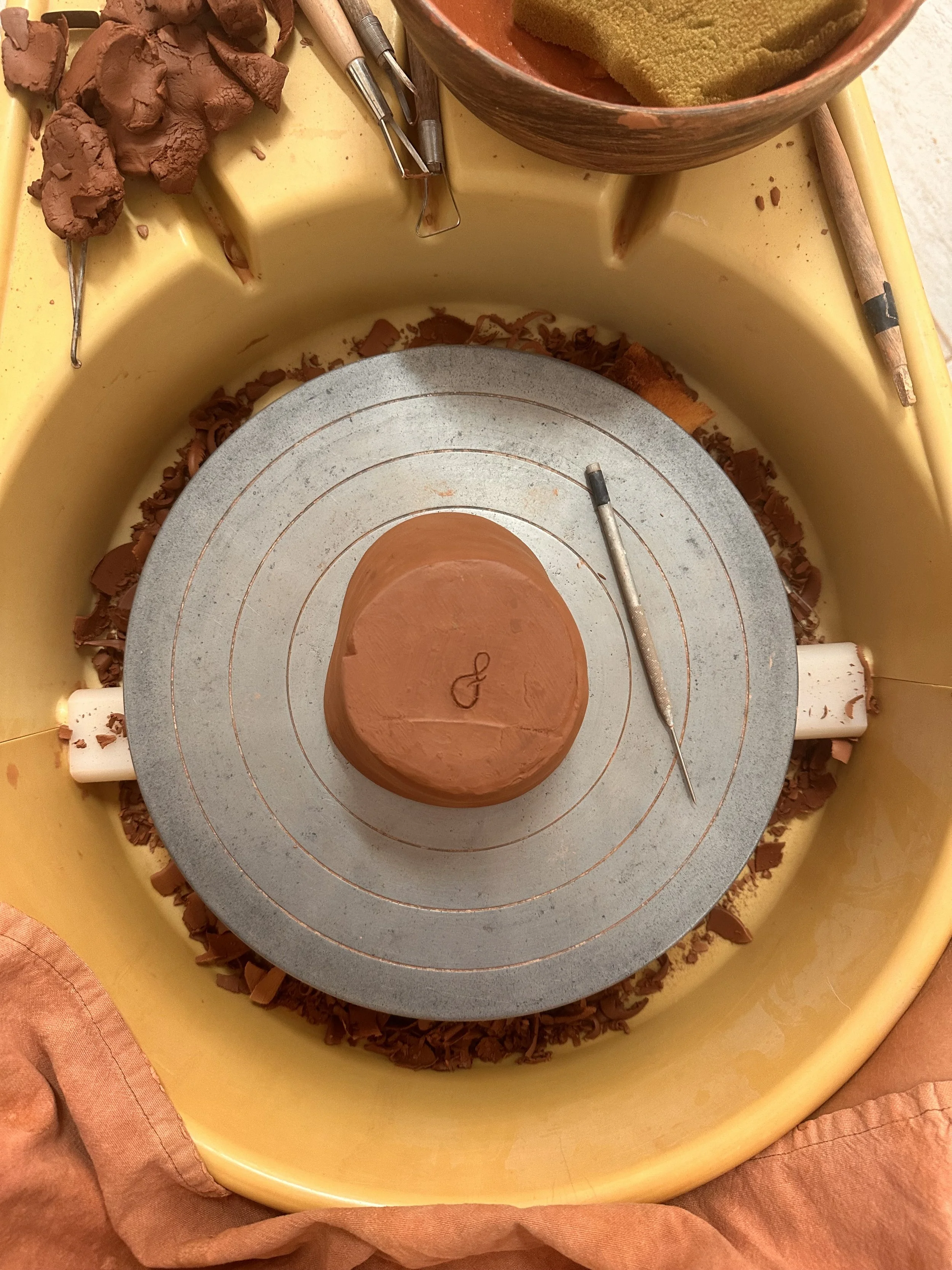 Terracotta pot on the wheel at a wheel throwing retreat in Portugal
