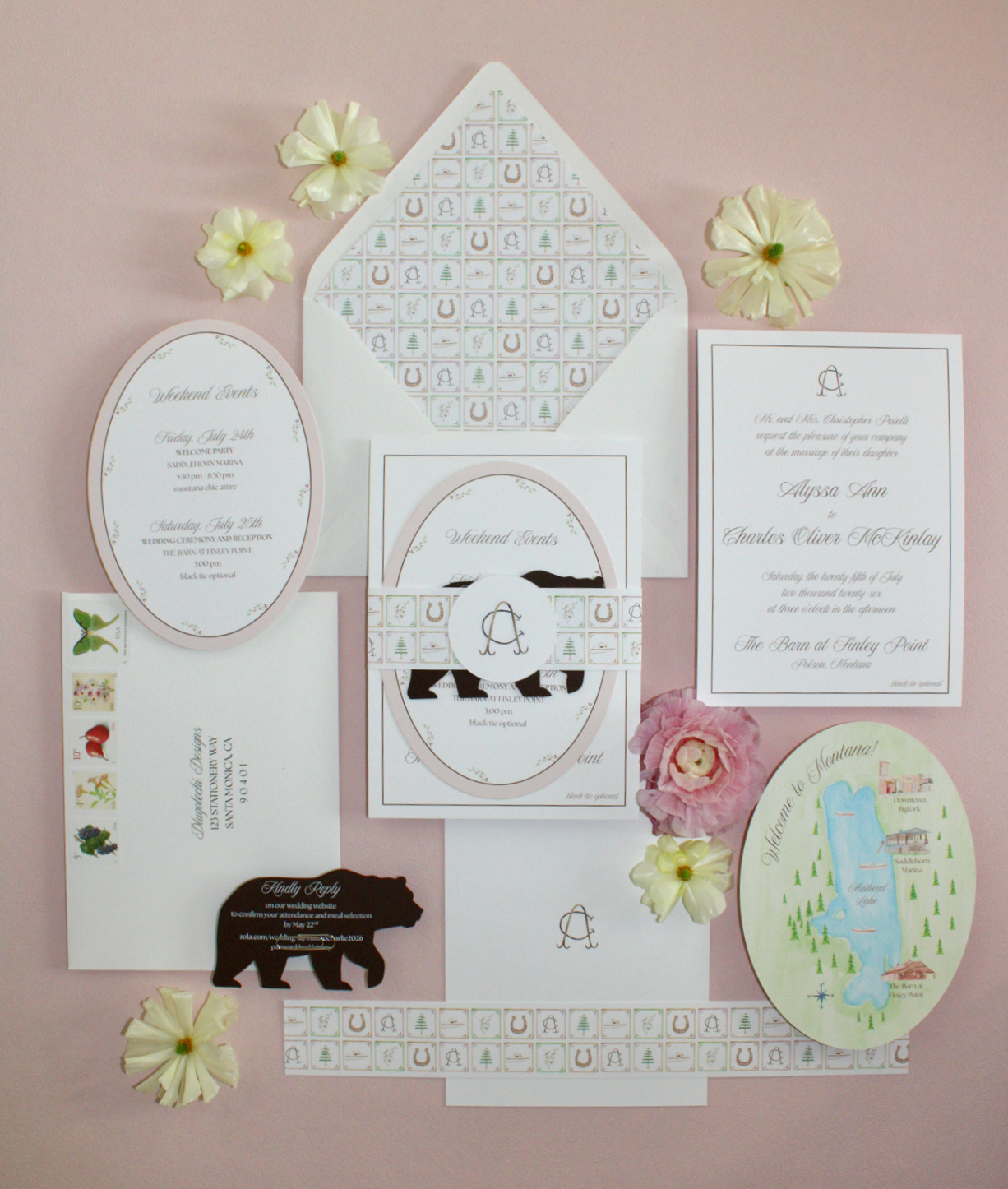 Wedding invitations and event plans laid out on pink background, decorated with artificial flowers.