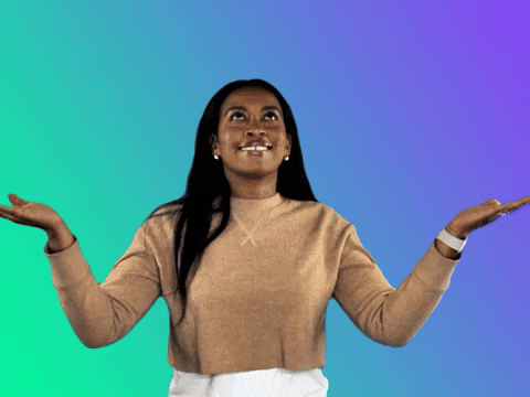 A young woman with long dark hair, wearing a beige top and white pants, stands with arms raised and palms facing upward against a colorful gradient background.