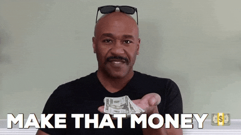 A man with sunglasses on his head and a mustache, holding cash and pointing at the camera, with the caption 'Make That Money'.