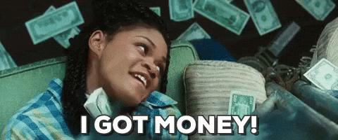 A woman smiling with money falling around her, captioned 'I GOT MONEY!'.