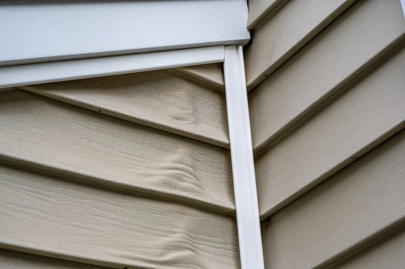 siding damage. melted and warped vinyl siding. defective construction product.