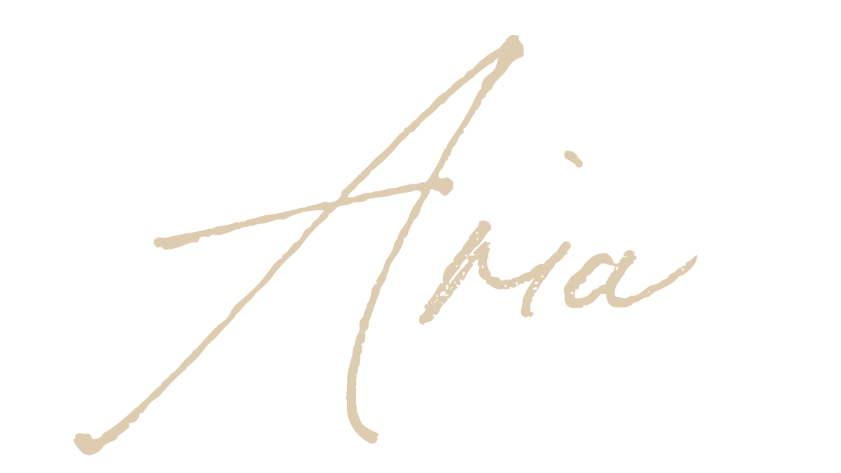 Elegant script displaying the word 'Asia' in beige font on a black background.